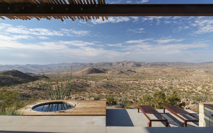 Joshua Tree Green Haus hot tub with 180-degree desert views, one of the best Airbnbs in Joshua Tree, California