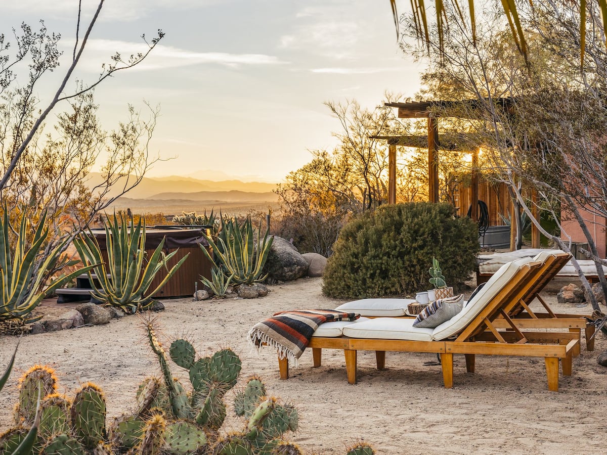 Casita by The Joshua House hot tub and lounge chairs in desert garden, one of the best Airbnbs in Joshua Tree, California
