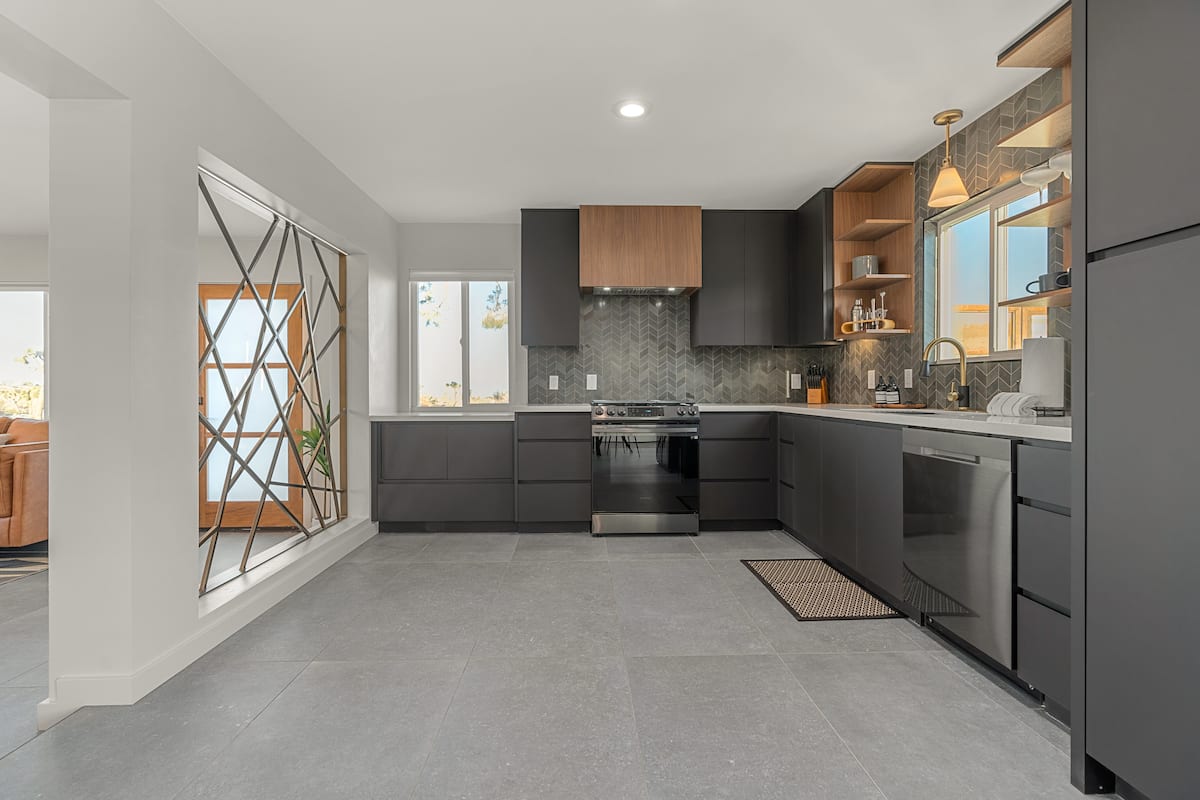 The Outlook modern kitchen with dark cabinets, one of the best Airbnbs in Joshua Tree, California