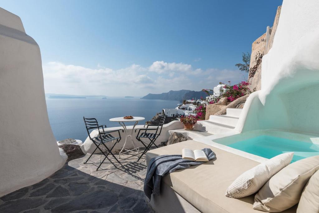 Terrace plunge pool with caldera view at the Sculptor's cave house by Cycladica, Oia Santorini